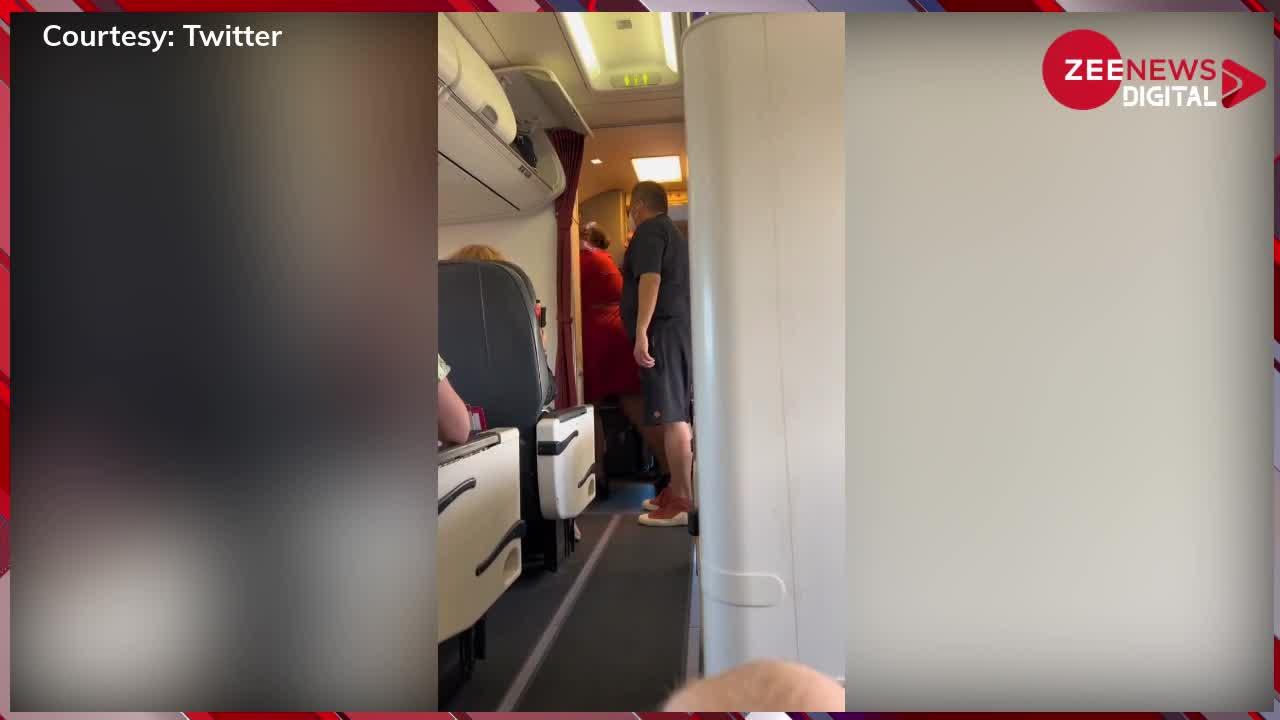 Viral Video: फ्लाइट में एयर होस्टेस के साथ की शख्स ने बदतमीजी, तो पायलट ने जमकर ली खबर