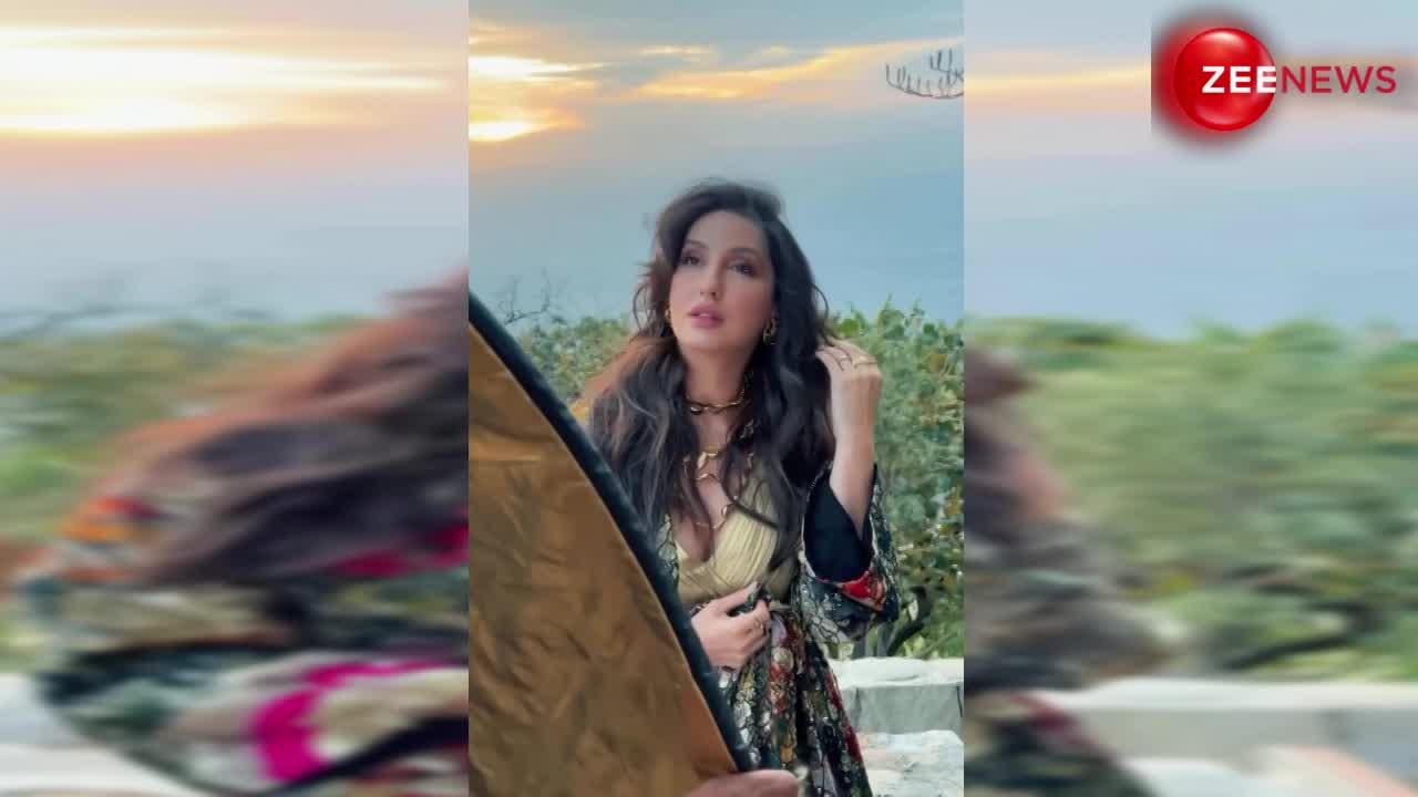 मल्टीकलर Shrug पहन सनसेट व्यू में किलर पोज देती नजर आईं Nora Fatehi, शेयर किया वीडियो